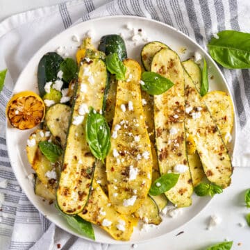 Grilled zucchini and squash on a plate.
