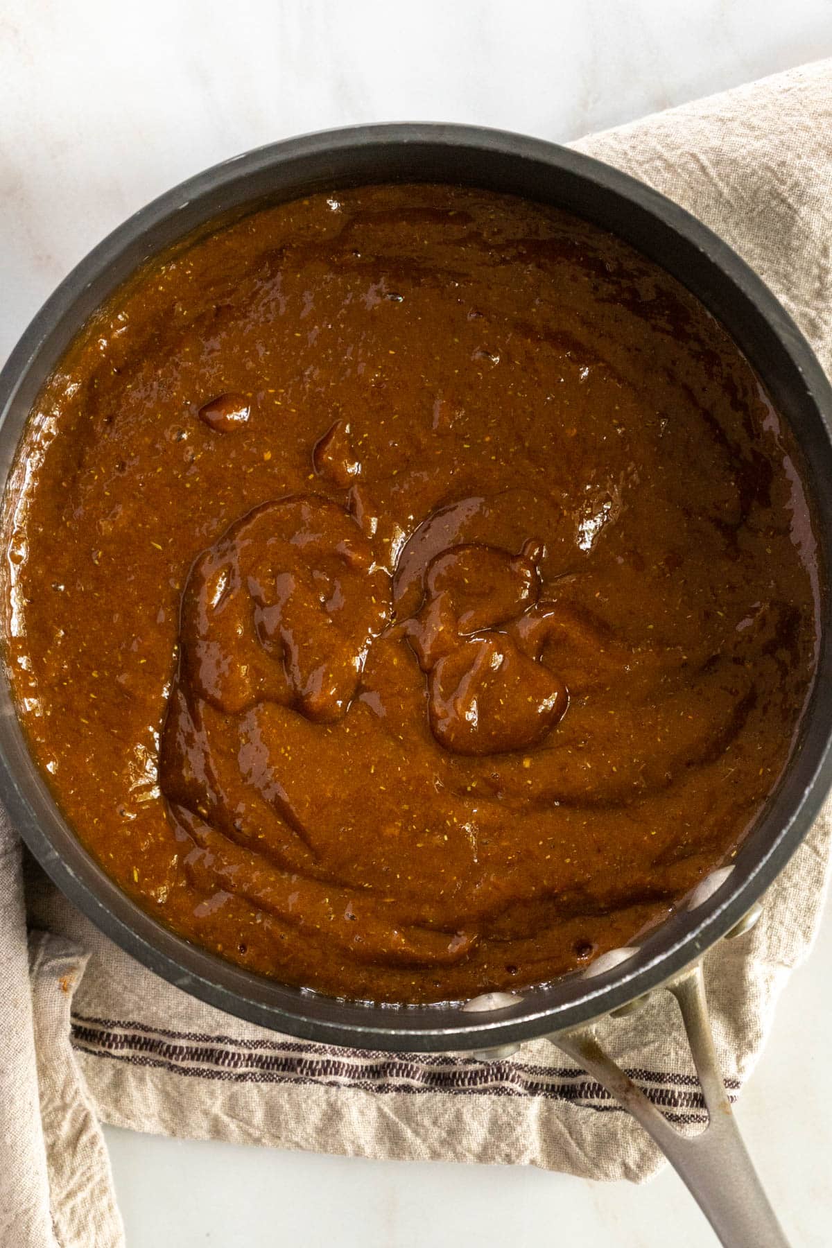 Cooking BBQ sauce in a pot.
