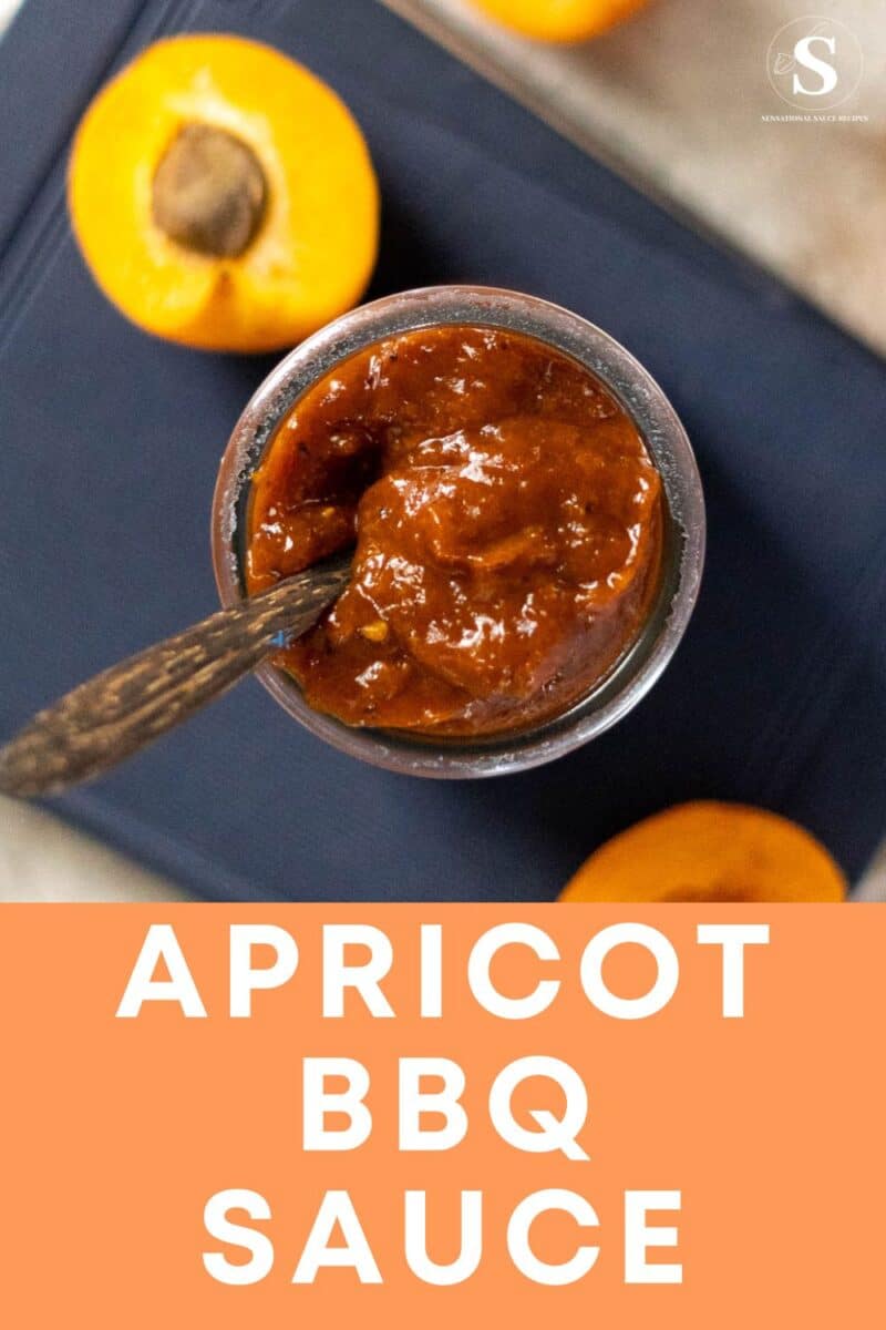 BBQ sauce in a jar with wooden spoon and sliced apricots.