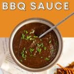 Spicy BBQ sauce in a bowl with a spoon.