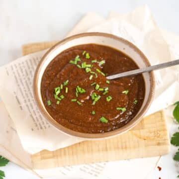 BBQ sauce in a bowl with a spoon