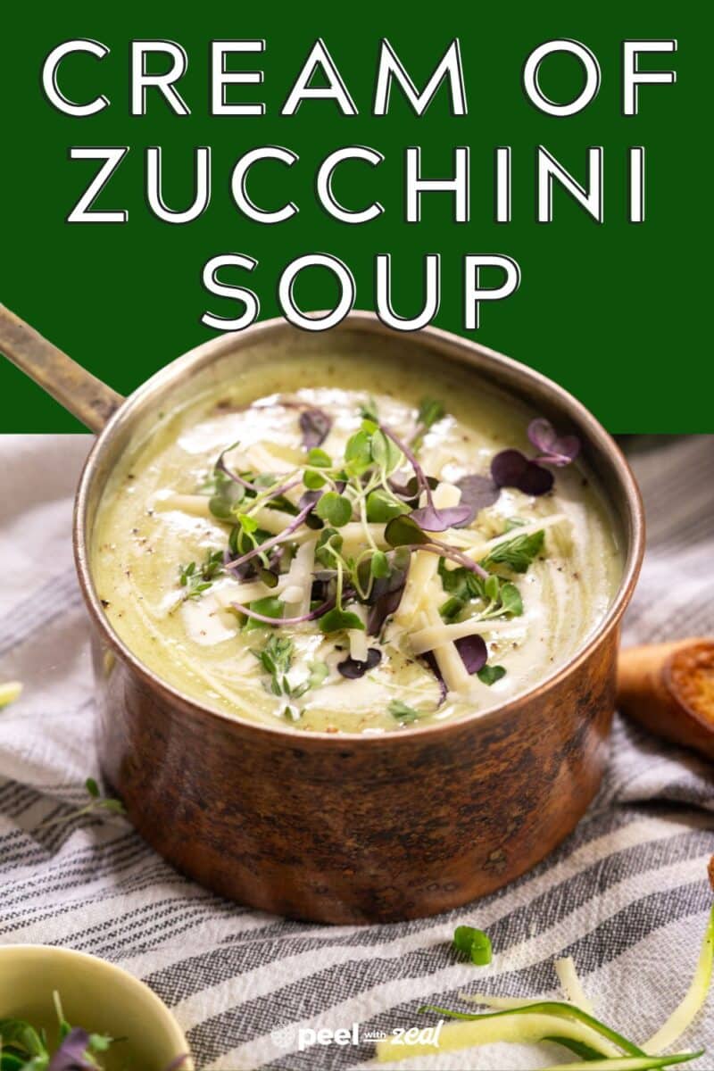 Pot of soup with herbs.