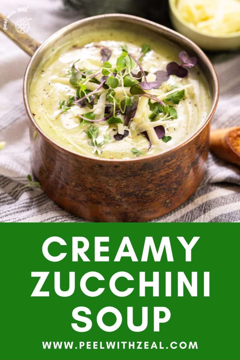 Pot of soup with herbs.