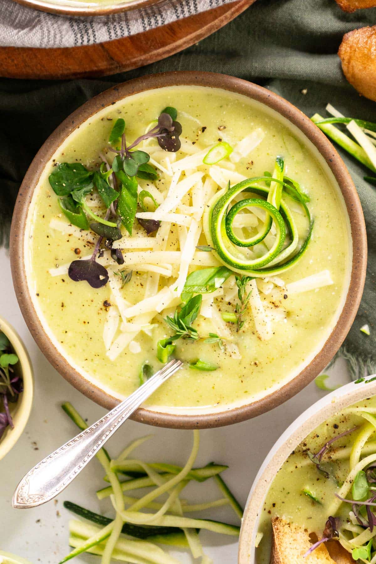 Bowl of zucchini soup with spiraled zucchini.