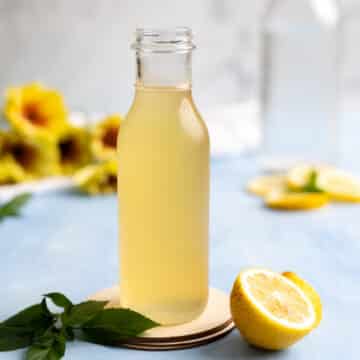 Chilled bottle of lemon syrup.
