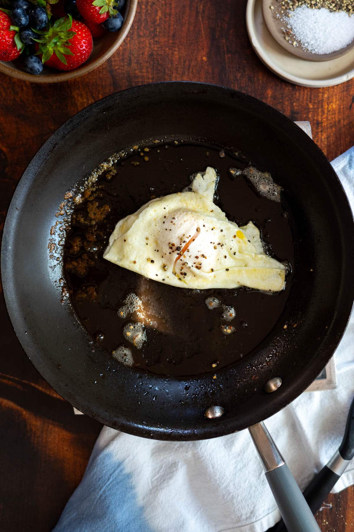 Over easy egg in a nonstick skillet.