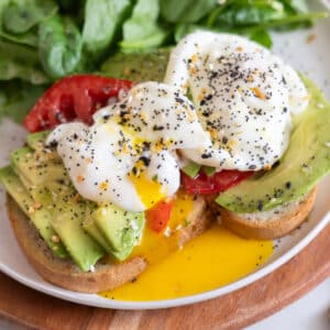 Perfectly poached eggs on avocado toast.