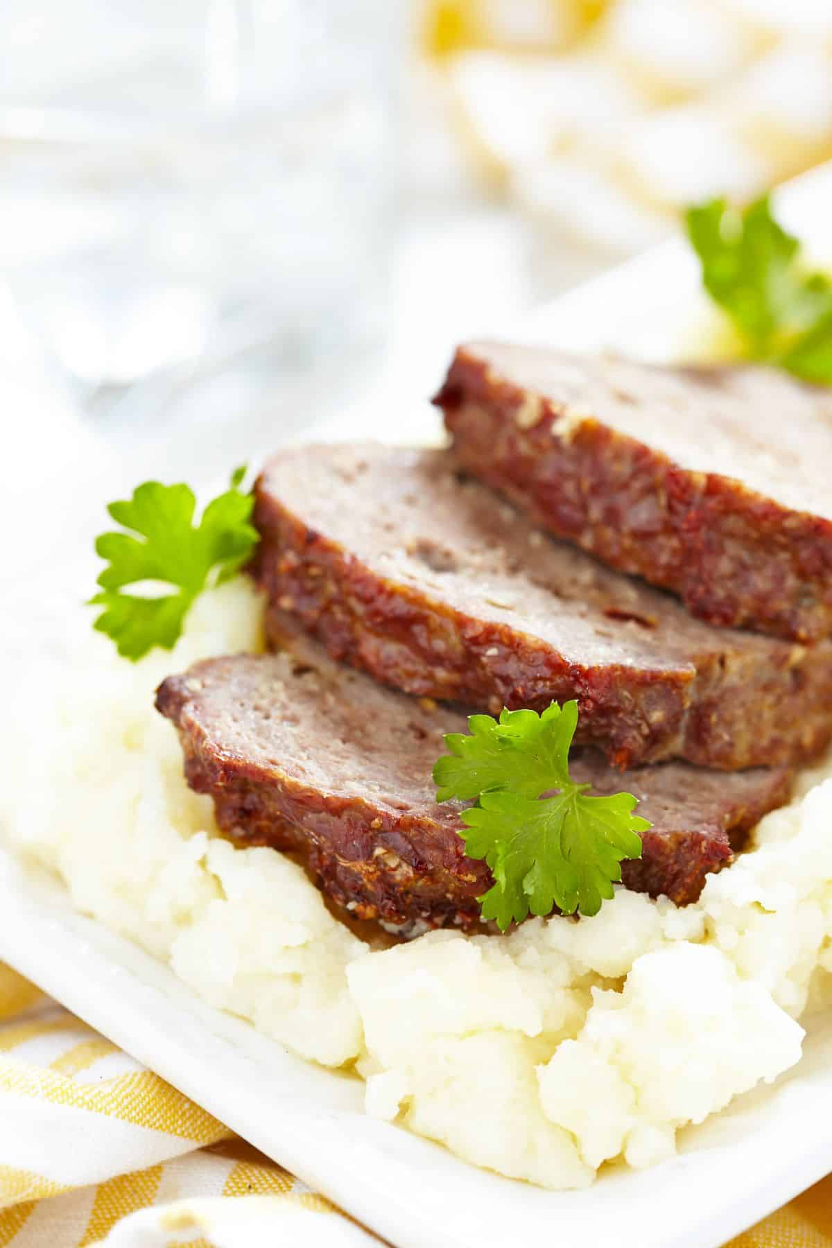 Gluten free meat loaf on mashed potatoes.