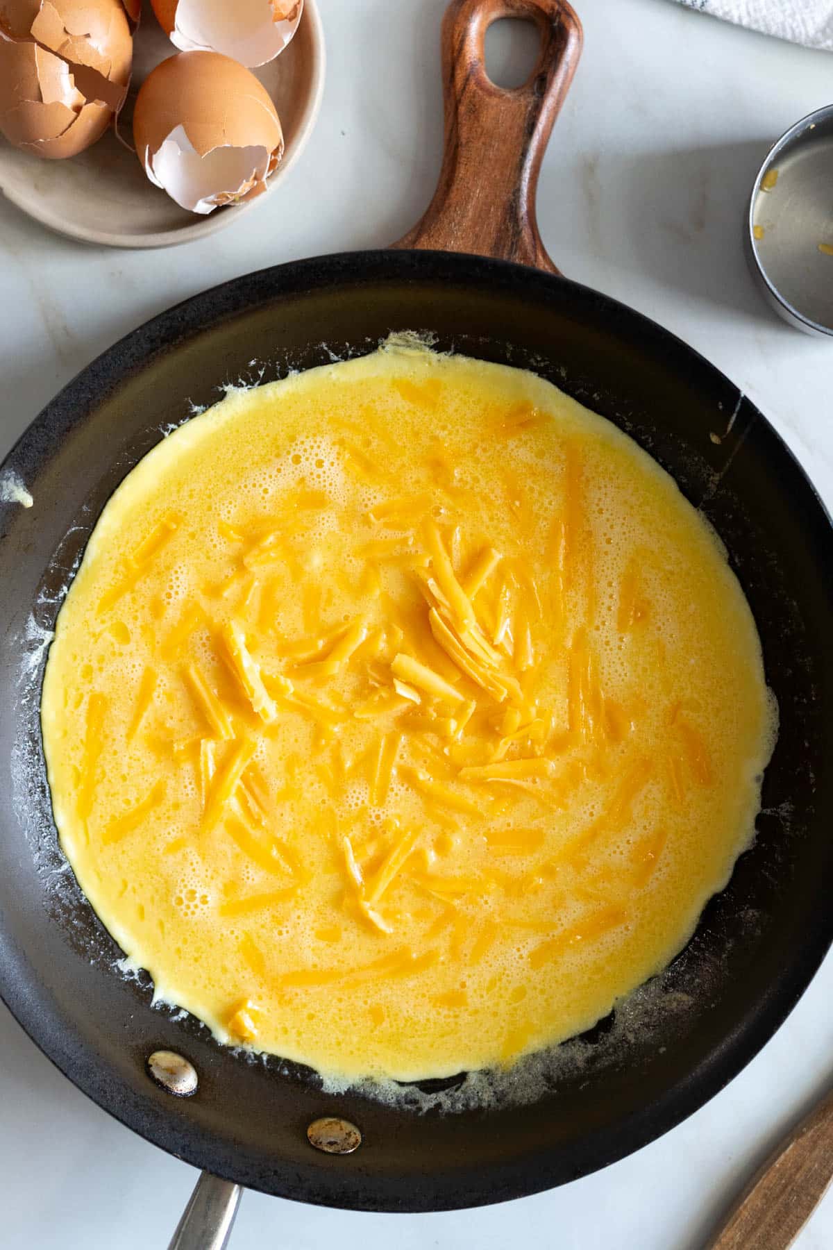 Cheddar cheese on eggs.