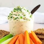 Dairy-free vegan cream cheese in a bowl with carrots and celery.