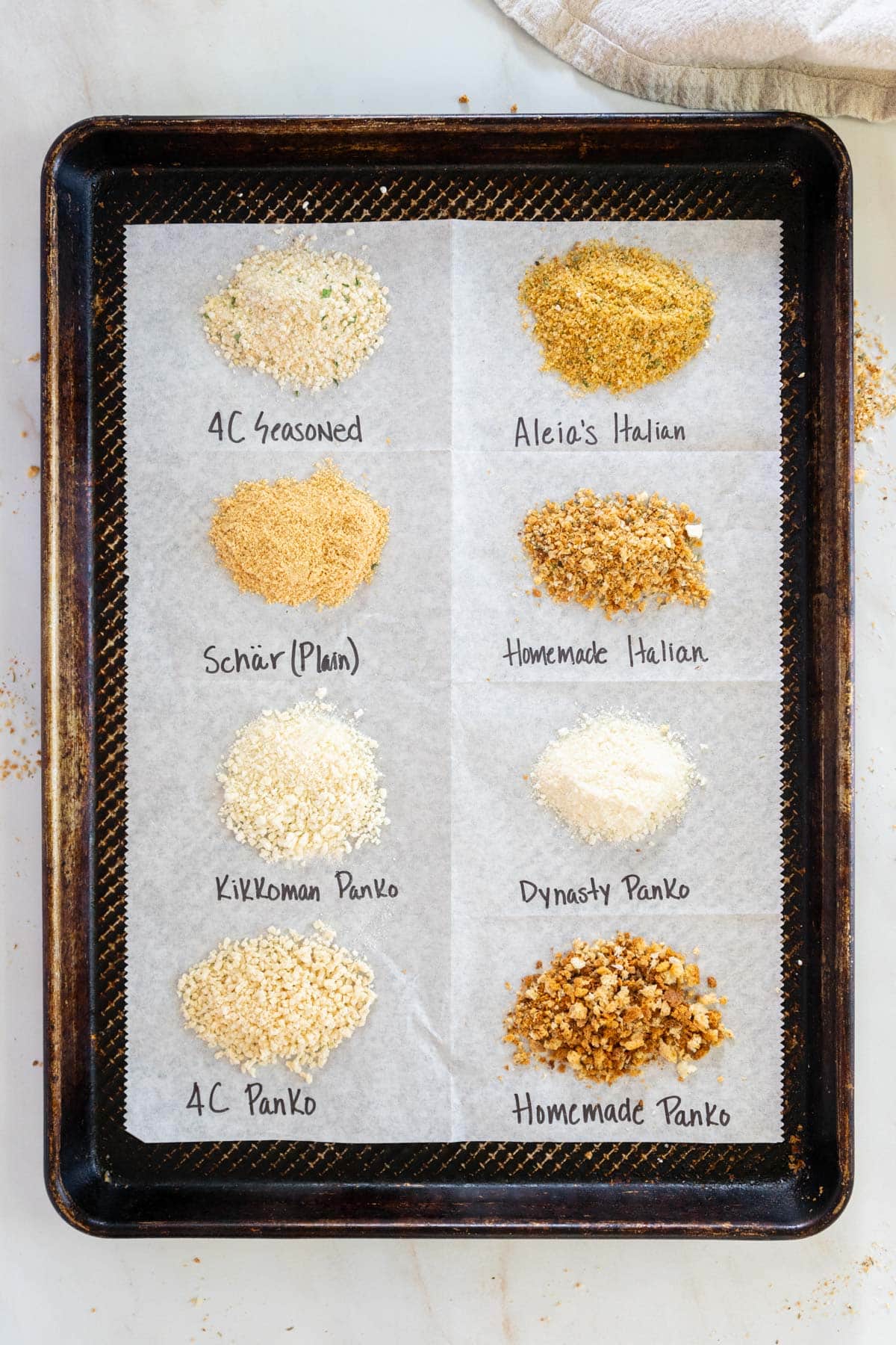 Gluten free bread crumb brands on a sheet pan with labels.