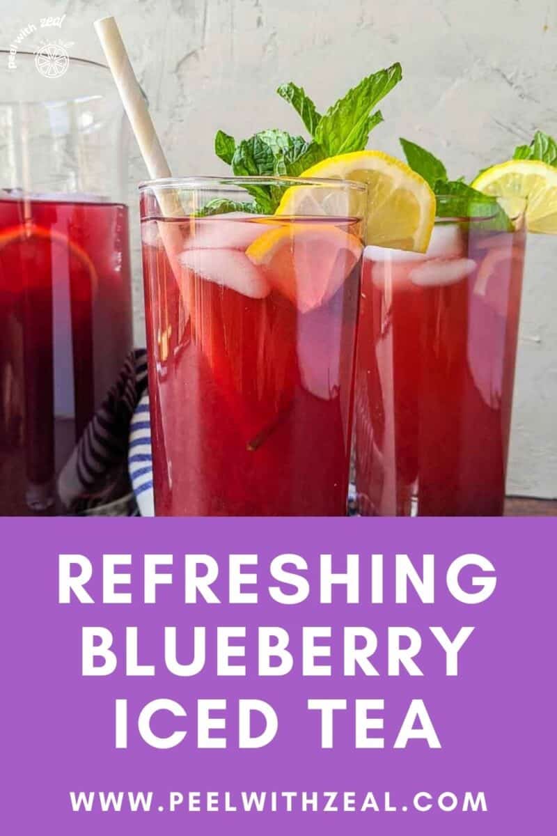 Two glasses of fruit tea flavored with blueberries and lemon.