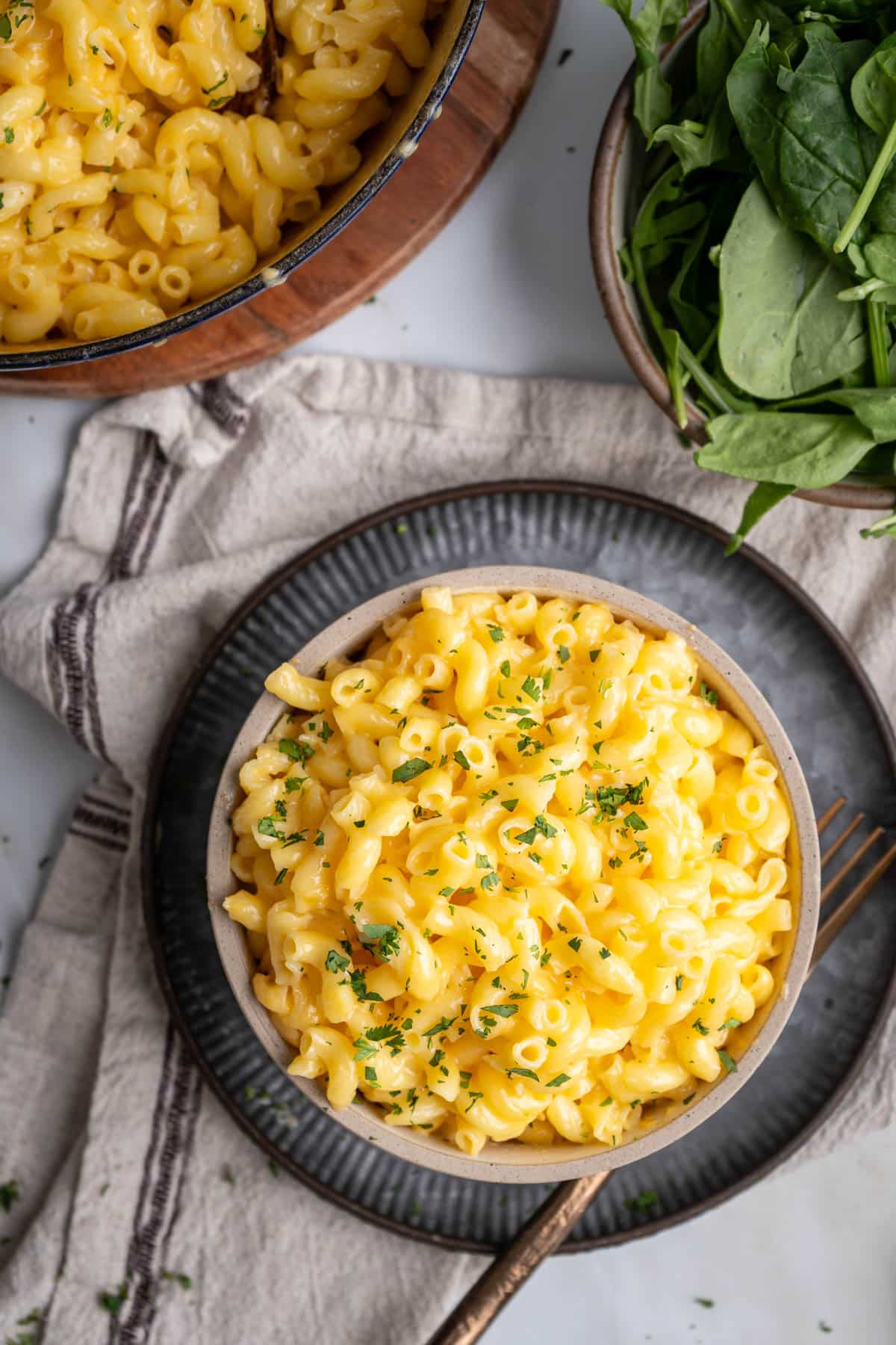 Gluten free macaroni and cheese in a bowl with fork.