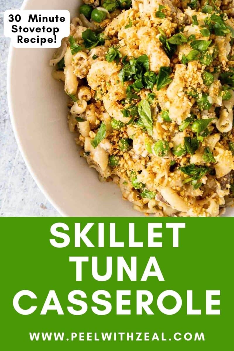 Skillet tuna casserole in a bowl with peas and parsley.