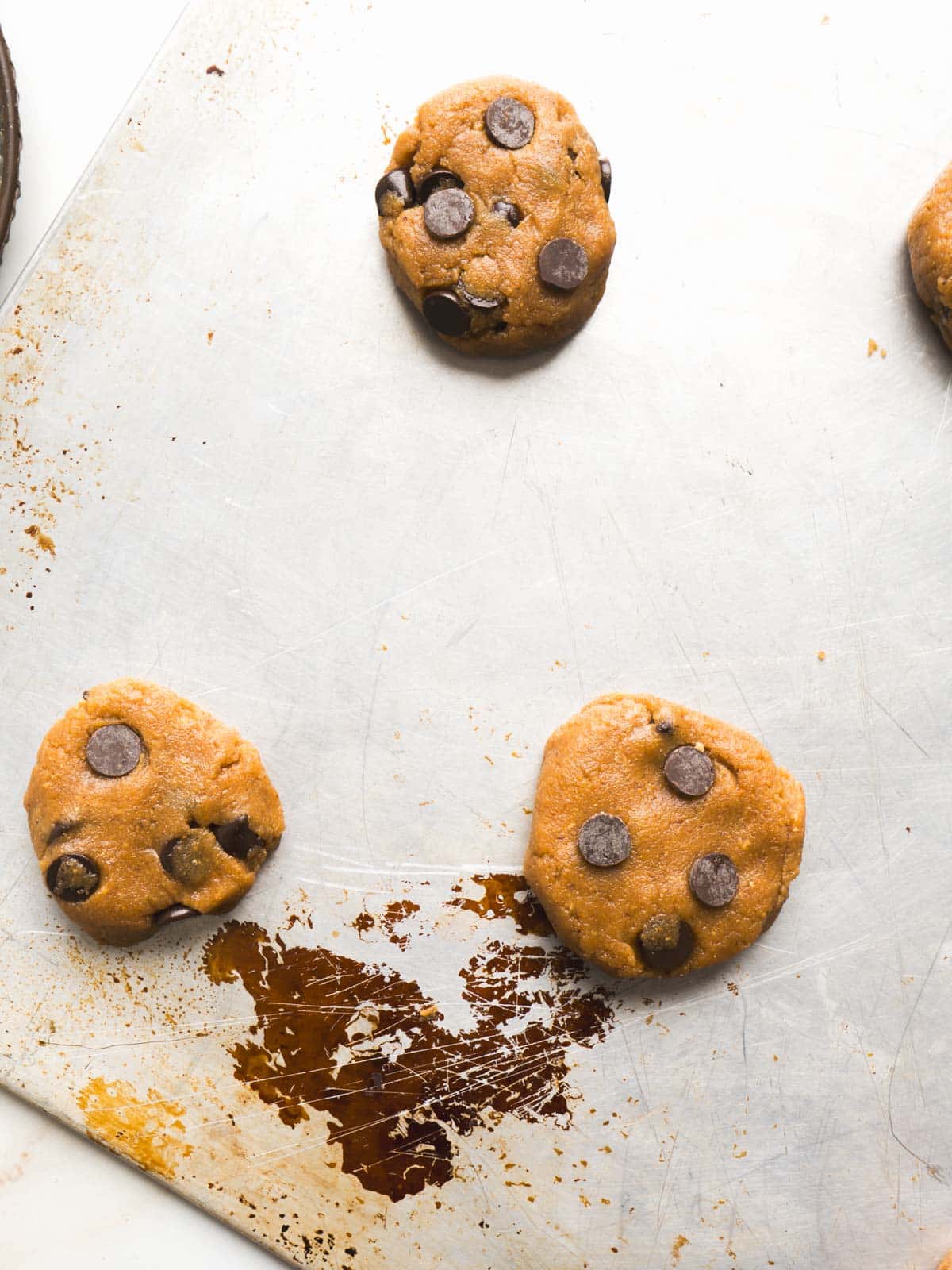 Forming cookies on a baking sheet.