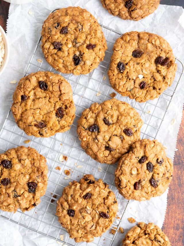 Oatmeal raisin cookies on a wire rack.
