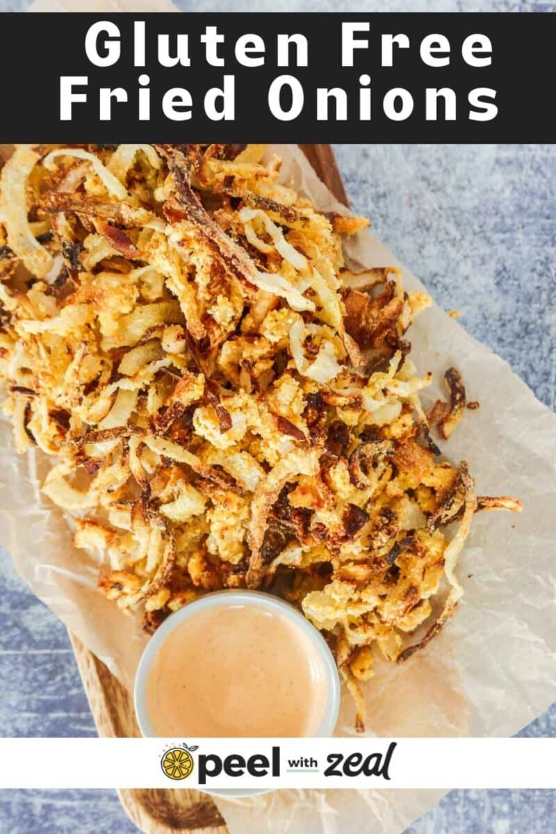 Onion straws on a plate with fry sauce.