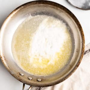 Making gluten-free roux in a pan.