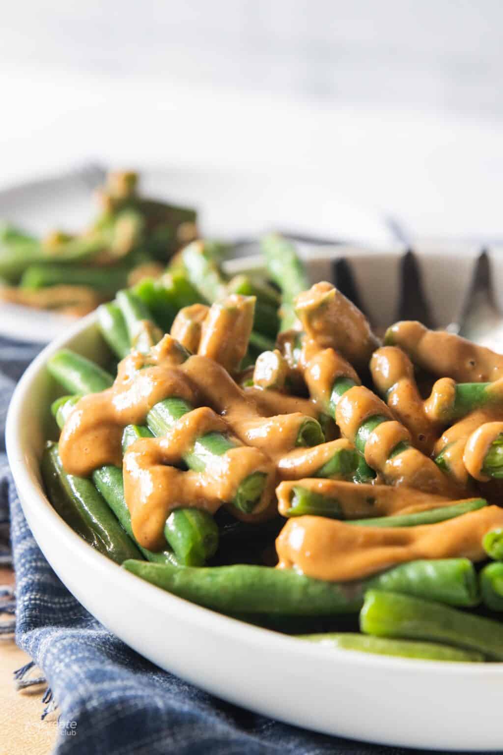 Green beans drizzled with peanut butter satay.