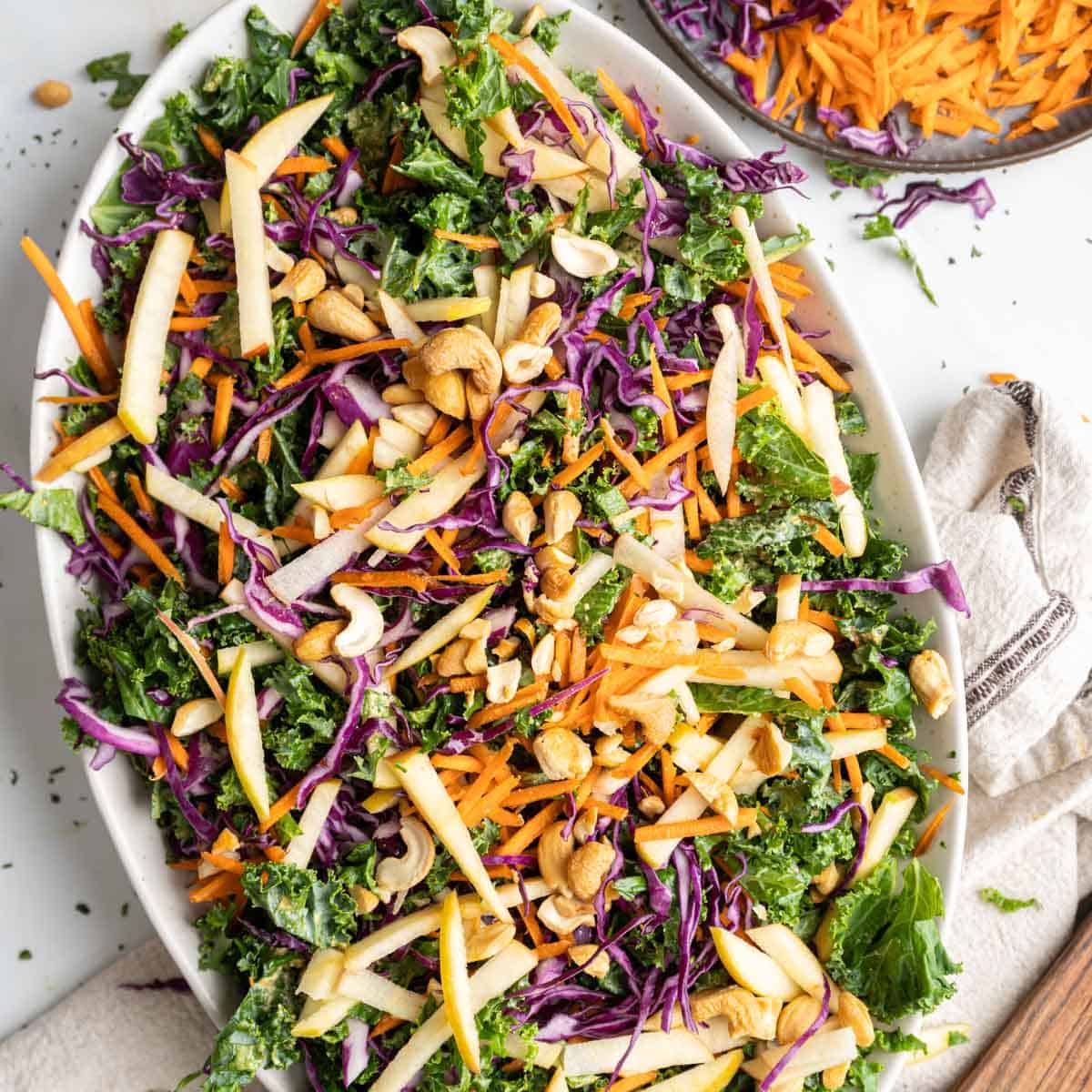 Kale apple slaw on a serving platter.