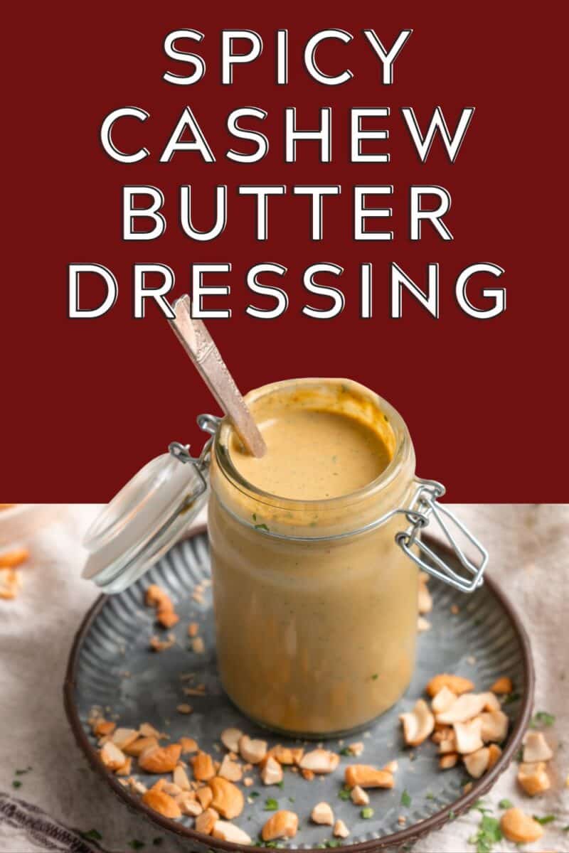 Spicy cashew dressing in a jar with a spoon.