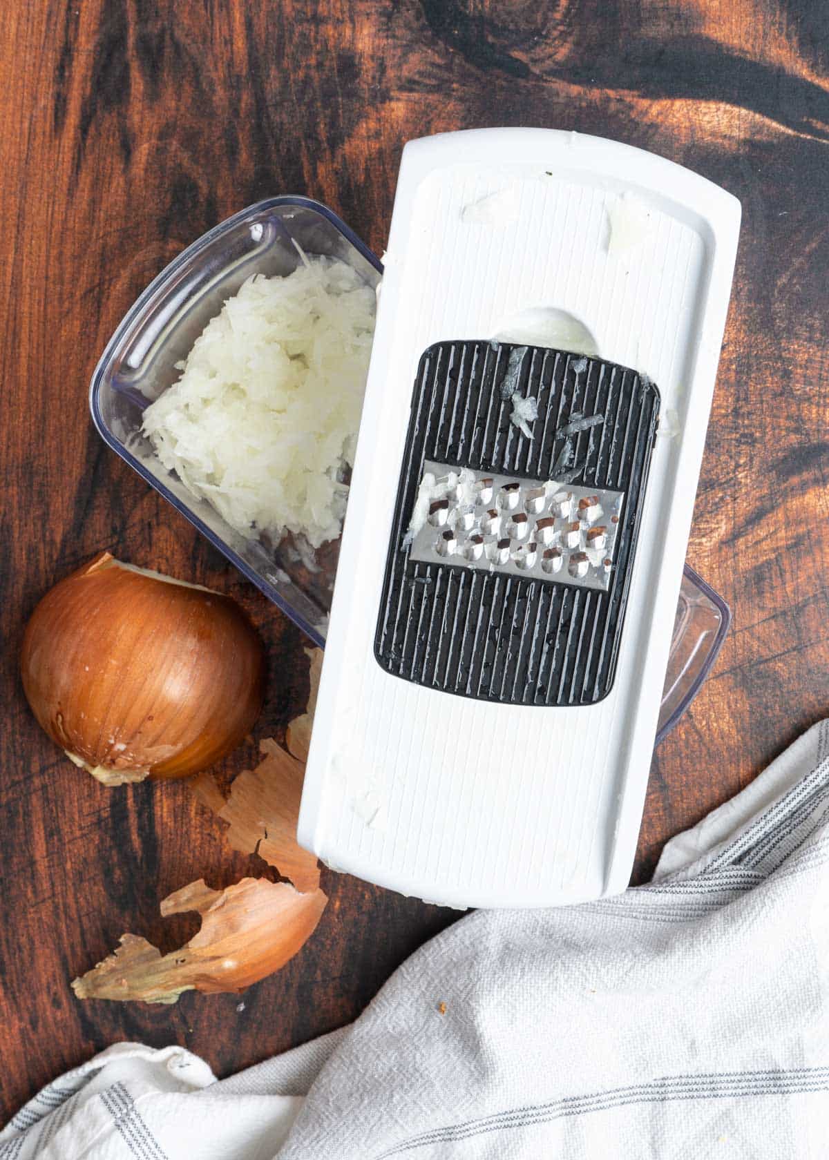 Grated onion and a box grater.