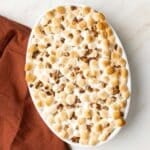 Sweet potato casserole in an oval baking dish.