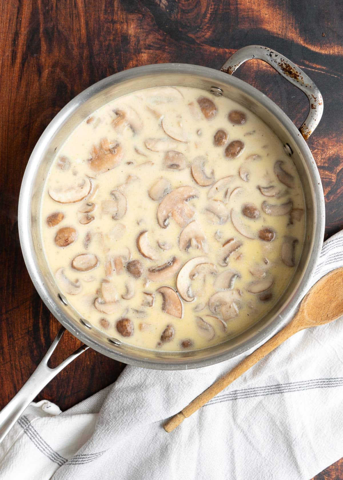 Mushroom with creamy sauce in a pot.