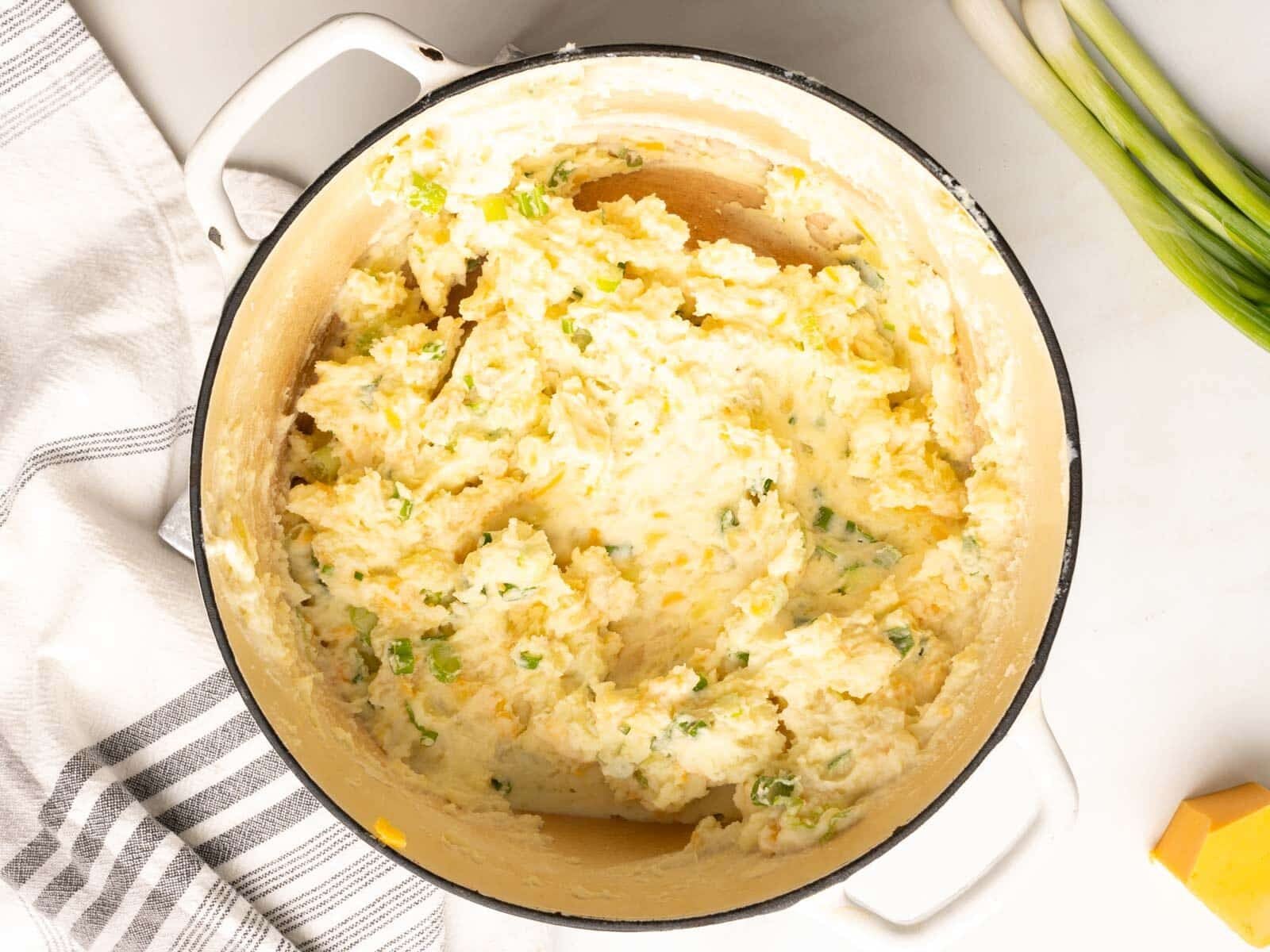 Mashed potatoes with green onion and cheese..
