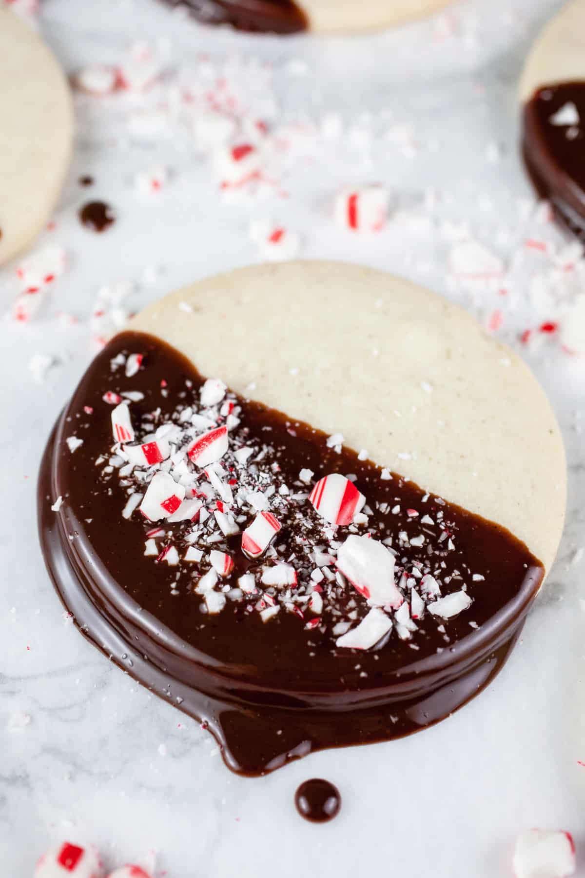 Peppermint shortbread cookies half dipped with chocolate.