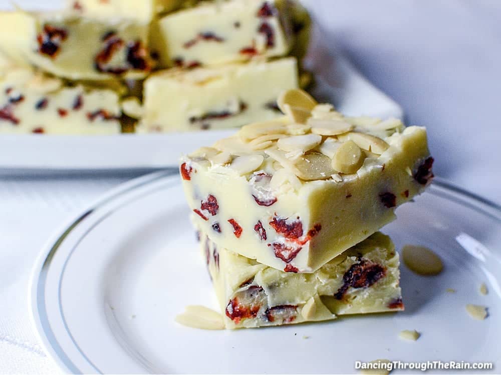White chocolate cranberry fudge topped with almonds.