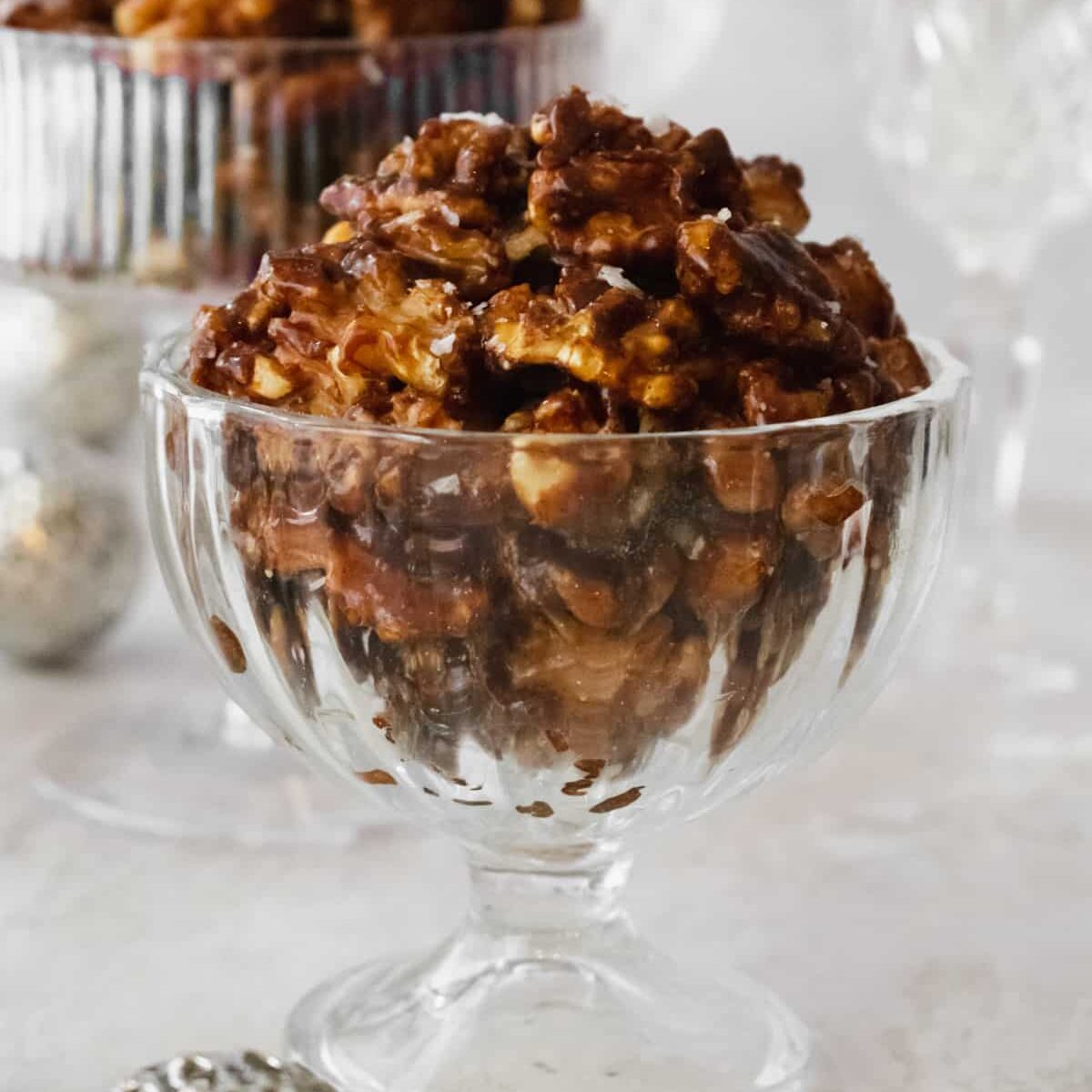 Candied walnuts in a fancy glass containers.