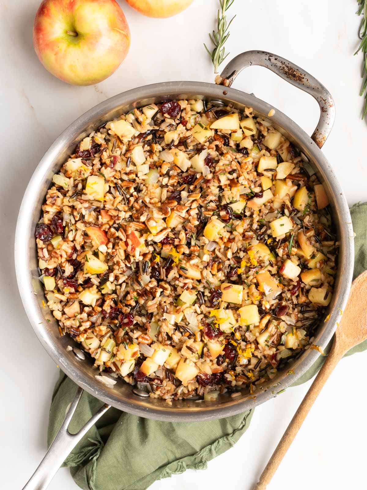 Wild rice with cranberries and apples in a pot.