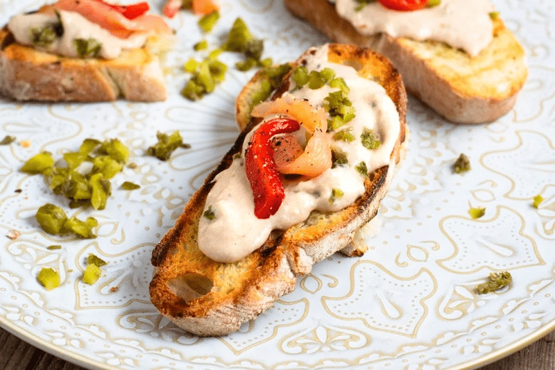 Crostini topped with sardine tapas.