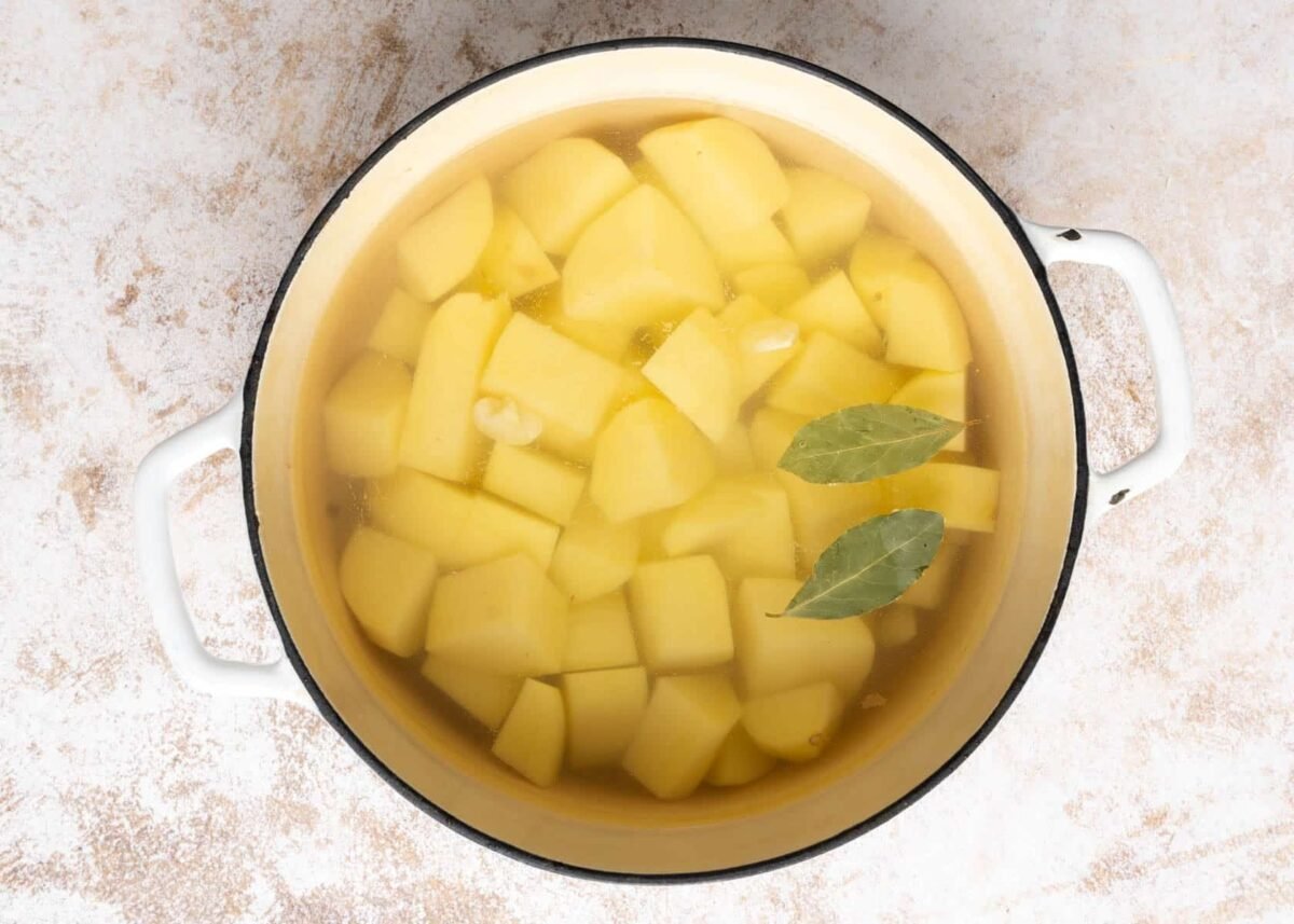 Potatoes in a large stock pot.