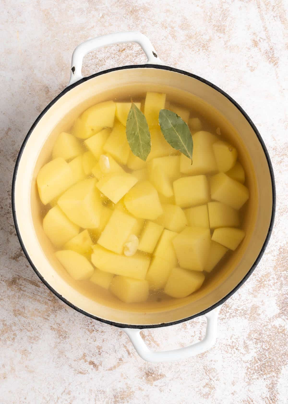 Potatoes in a large stock pot.