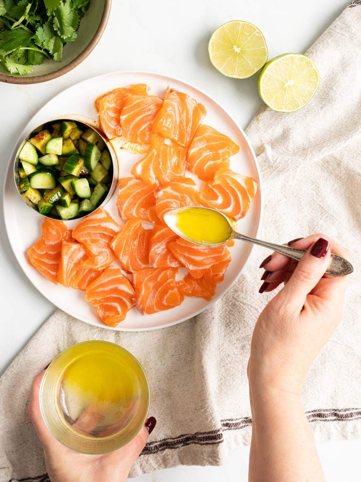 Salmon slices topped with yellow sauce.