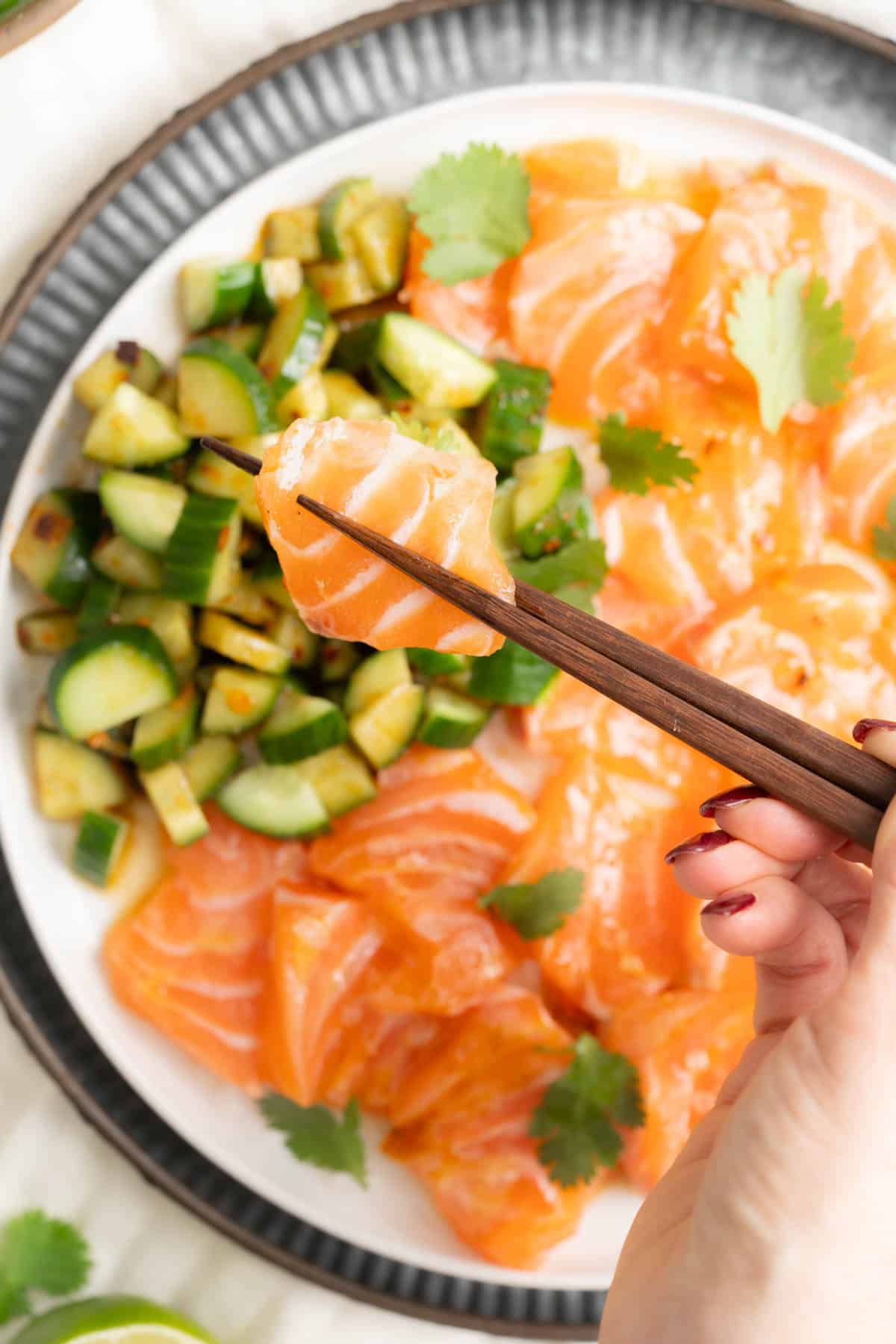 Salmon Crudo in chopsticks.