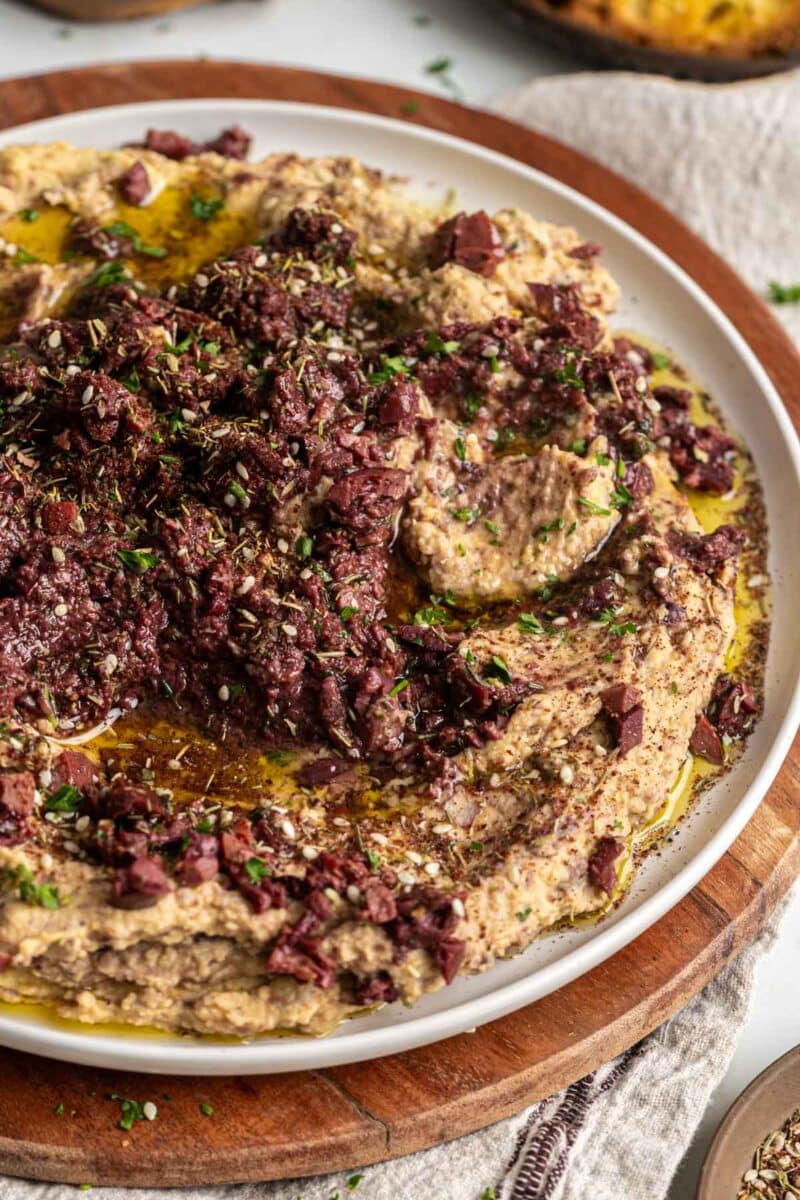 Kalamata olive hummus on a plate.