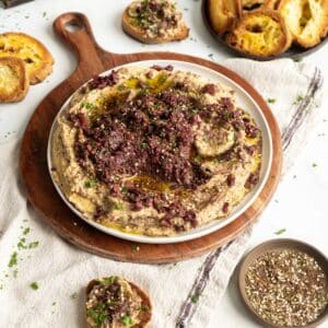 Kalamata olive hummus on a plate.