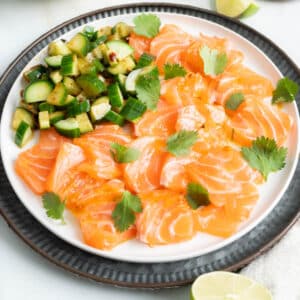 Salmon Crudo with spicy cucumber slices.