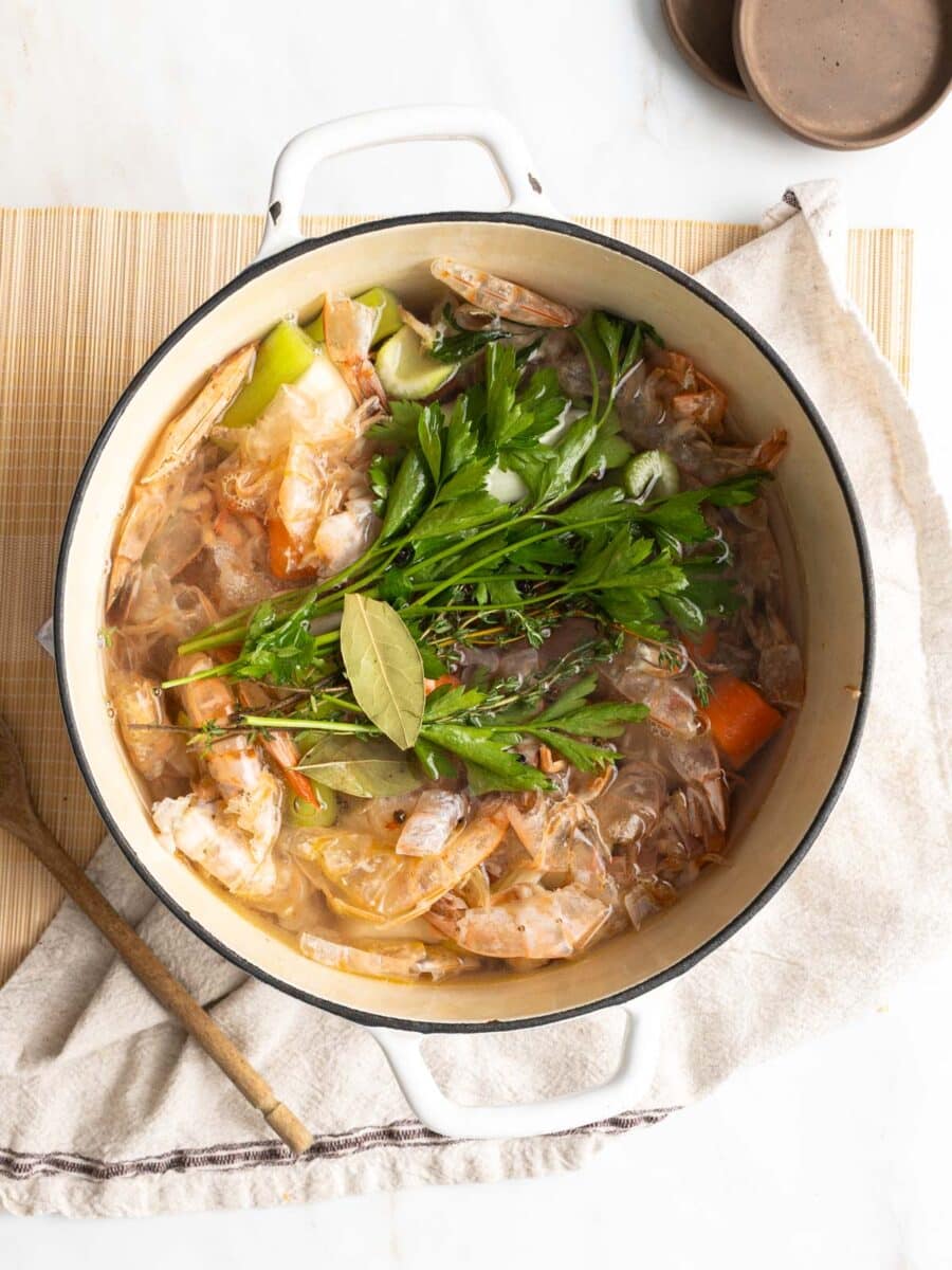 Shrimp stock ingredients in a pot.