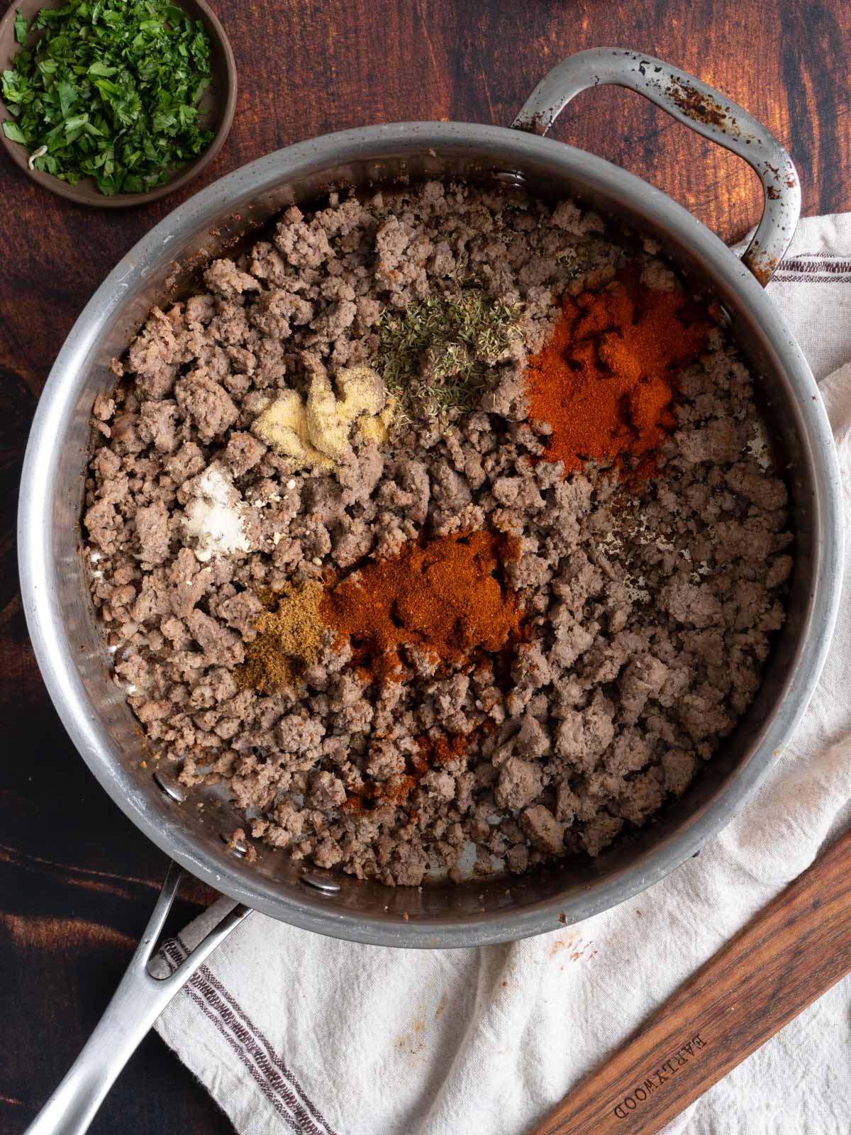 Meat with spices in a pot.