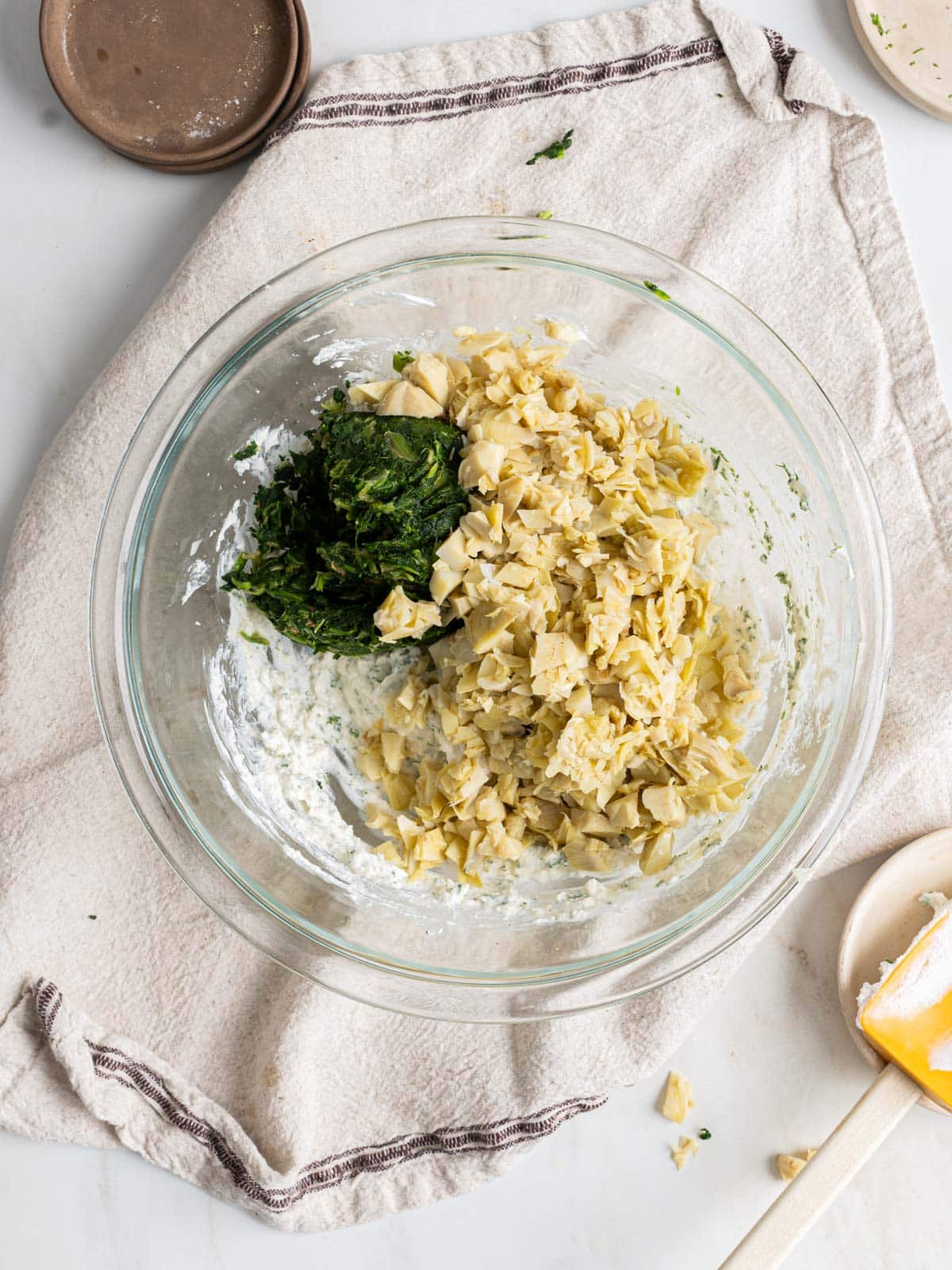 Spinach artichoke dip ingredients in a bowl.