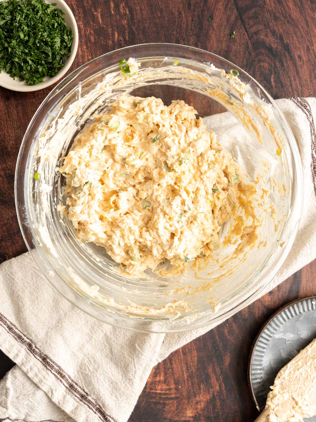 Cajun crab dip ingredients in a bowl.