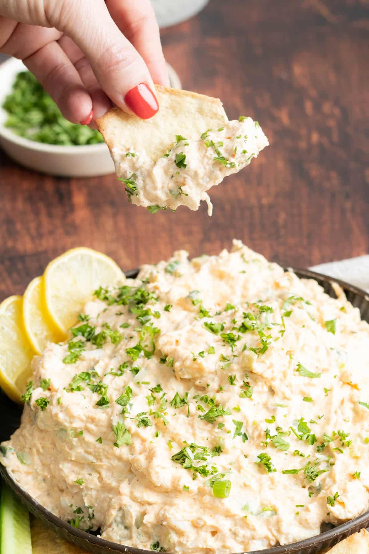 Cold Cajun crab dipped with a cracker.