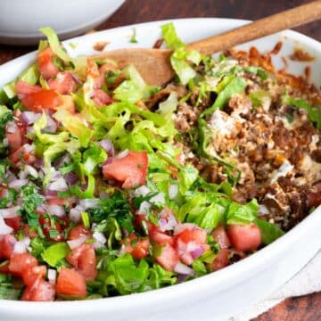 Ground beef taco dip in a dish.