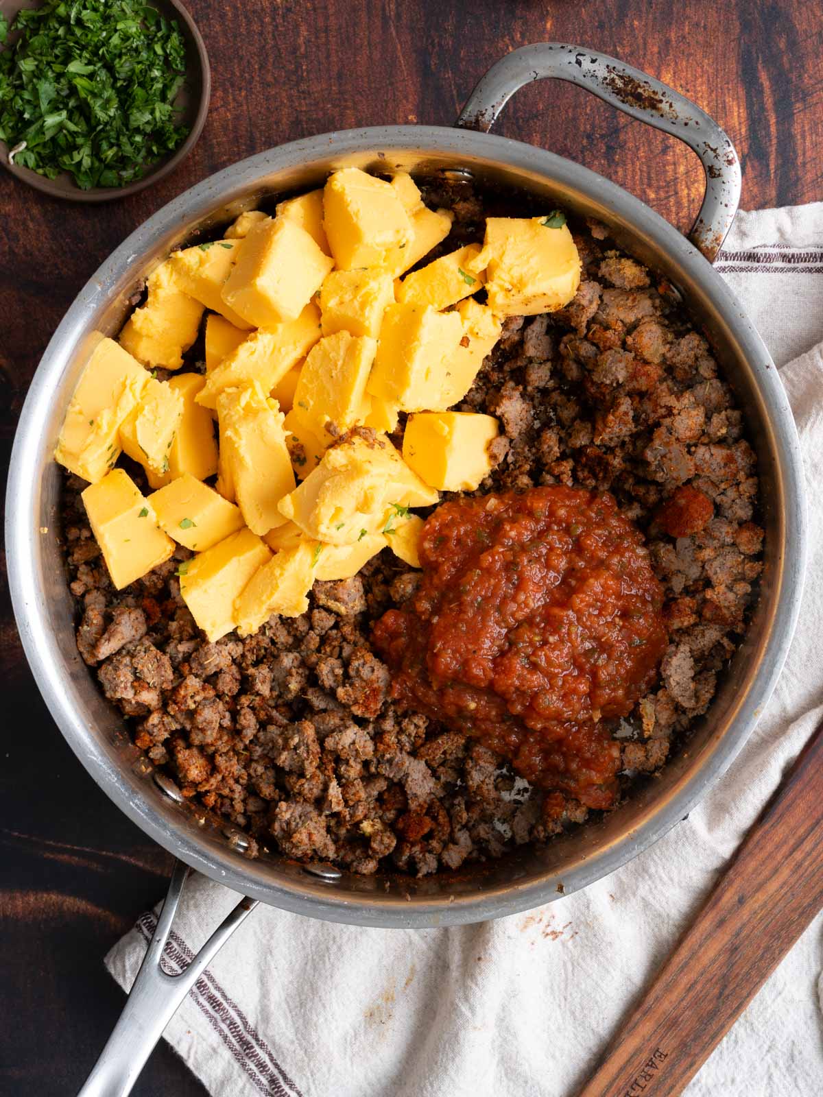 Meat with butter and sauce in a pot.