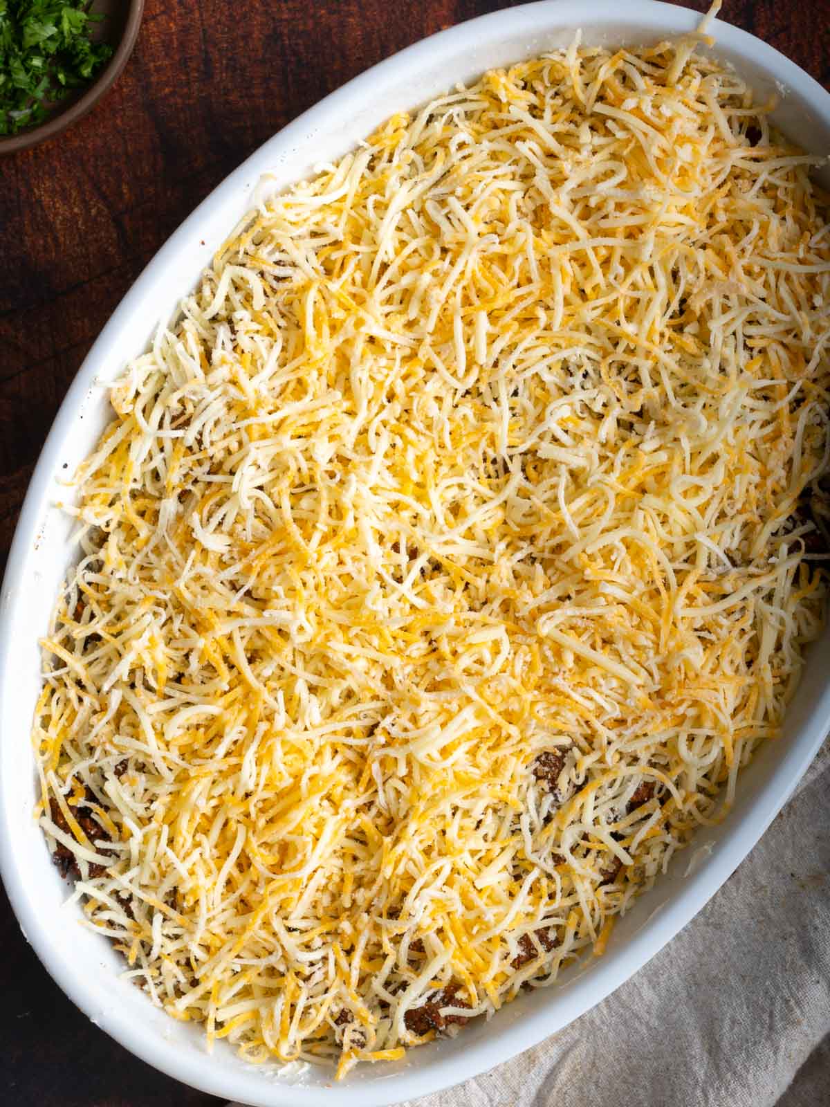 Cheese on top of the taco meat.
