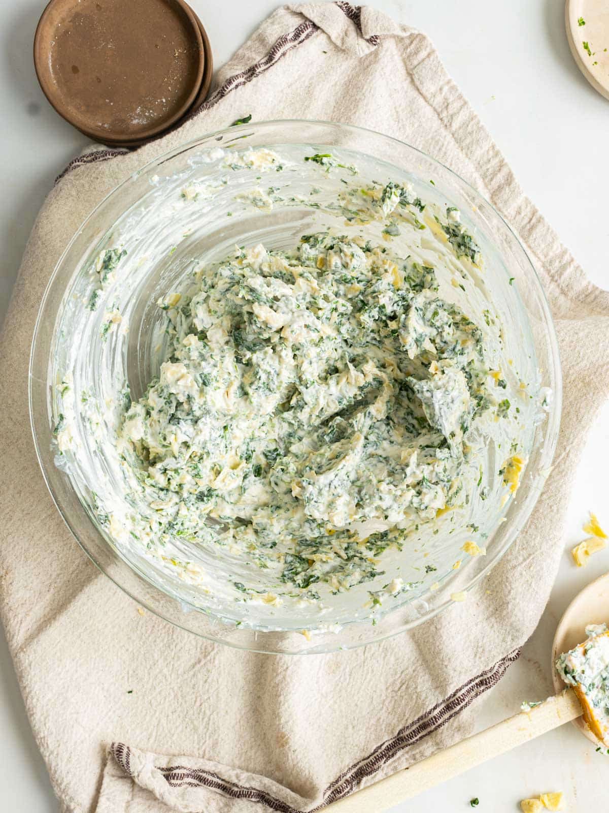 Spinach artichoke dip ingredients in a bowl.